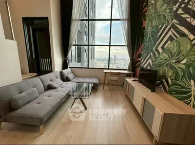 Stylish living room with floor-to-ceiling windows and modern decor