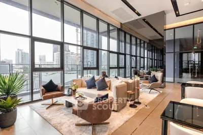 Luxurious modern living room with floor-to-ceiling windows and city view, elegant furniture and decor.