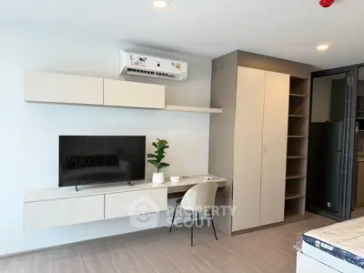 Modern bedroom with built-in storage and sleek desk setup, ideal for urban living.