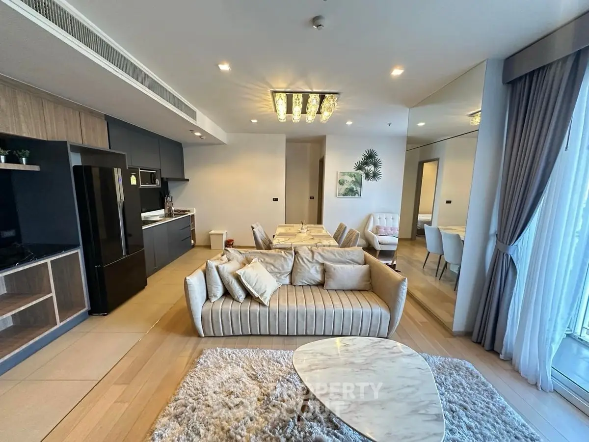 Luxurious modern living room with open kitchen and elegant decor