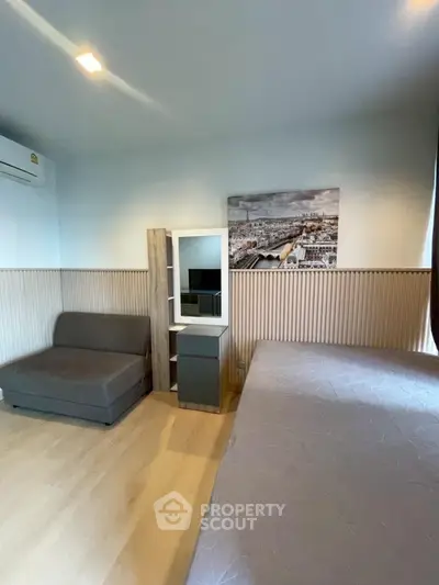 Modern bedroom with stylish decor and cozy furniture, perfect for urban living.