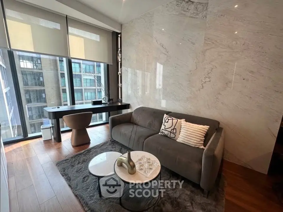 Modern living room with elegant decor and large windows in a luxury apartment.