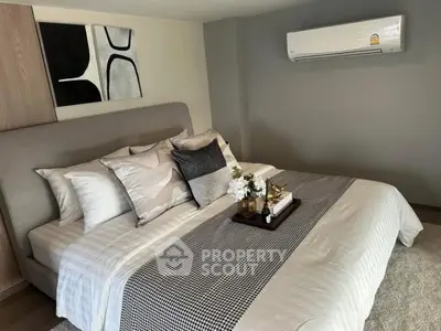 Modern bedroom with stylish decor and air conditioning