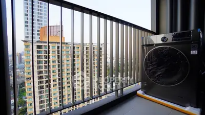 Modern balcony with city view and washing machine, perfect for urban living.