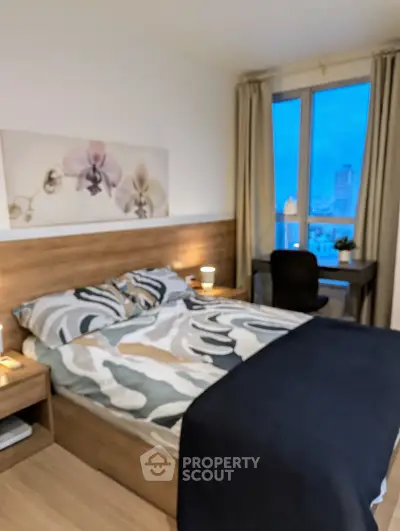 Modern bedroom with city view, stylish decor, and cozy ambiance