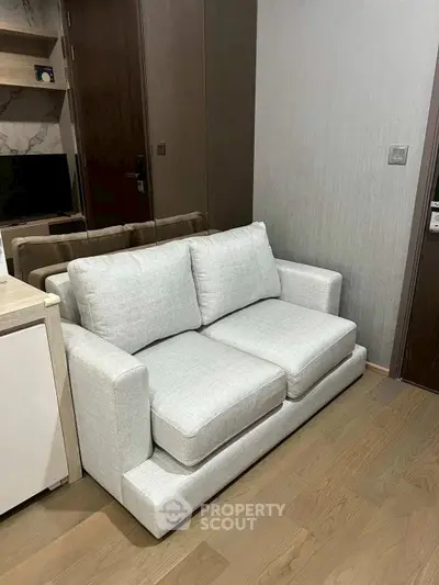 Modern living room with stylish sofa and wooden flooring