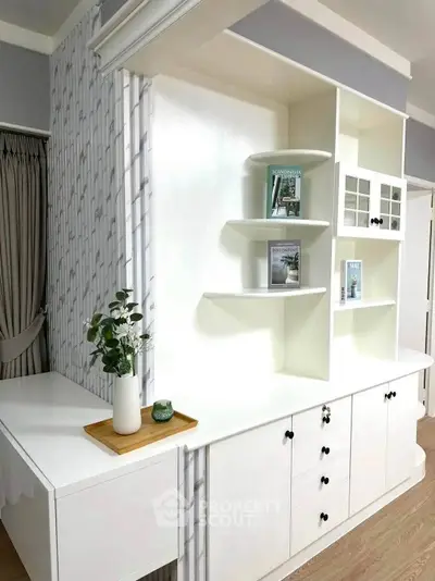 Modern interior with stylish shelving and elegant decor in a bright living space.