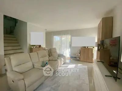 Spacious living room with modern furniture and natural light