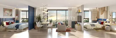 Luxurious open-plan living room with dining area and two beds, featuring stunning sunset views.