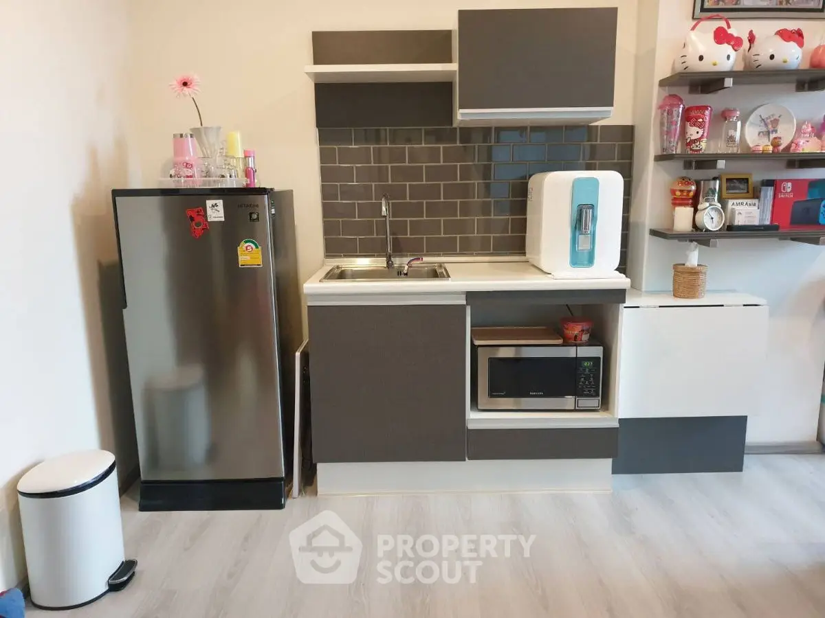 Modern compact kitchen with sleek appliances and stylish shelving