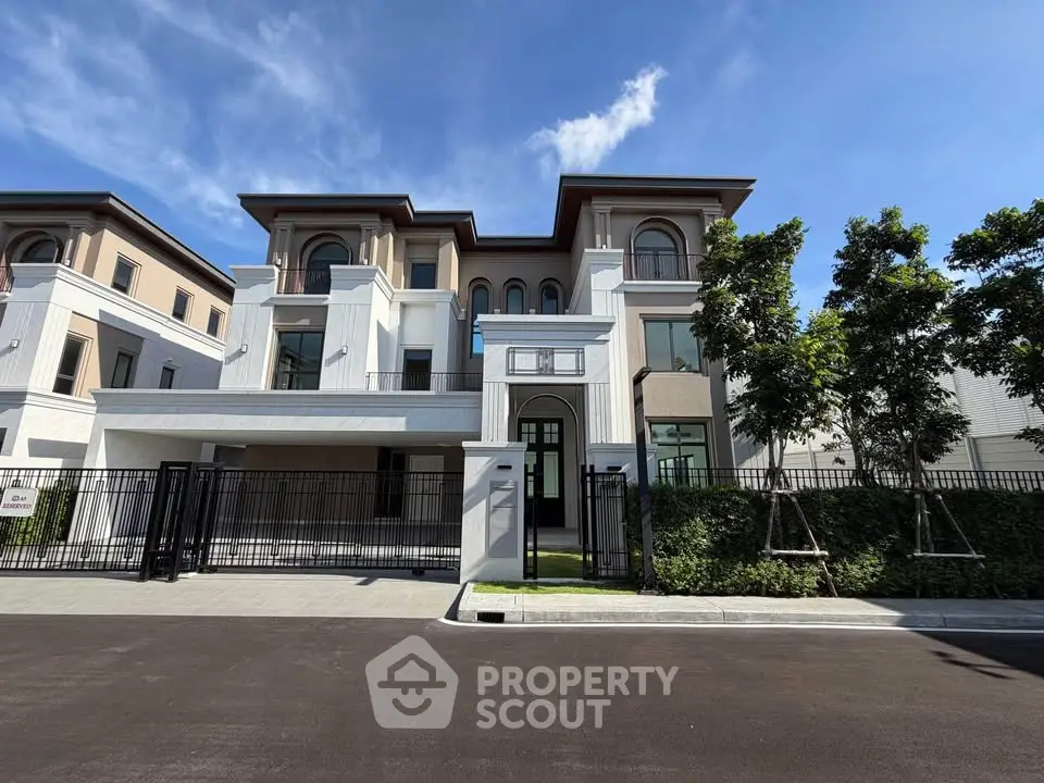Luxurious modern house exterior with elegant architecture and lush greenery, perfect for upscale living.