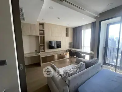Modern living room with sleek design and city view balcony