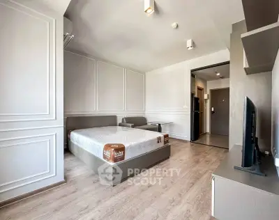 Spacious modern bedroom with elegant decor and natural light