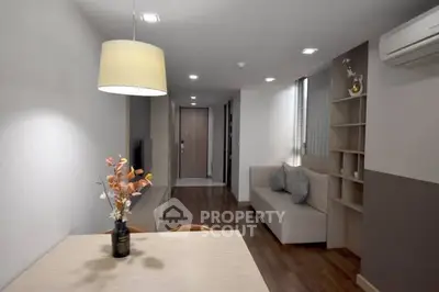 Modern living room with stylish decor and cozy seating area in a contemporary apartment.