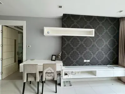 Modern living room with stylish wallpaper and sleek furniture