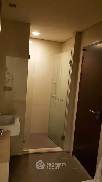 Modern bathroom with glass shower door and sleek design