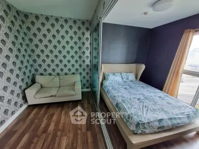 Modern bedroom with stylish wallpaper and cozy bed in a chic apartment.