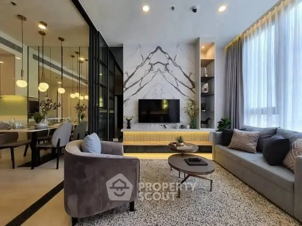 Luxurious modern living room with elegant decor and marble accent wall