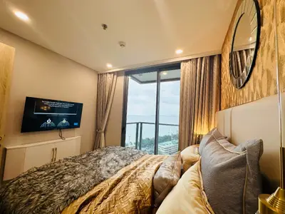 Luxurious bedroom with stunning ocean view and elegant decor