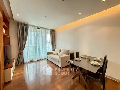 Spacious modern living room with elegant dining area and city view