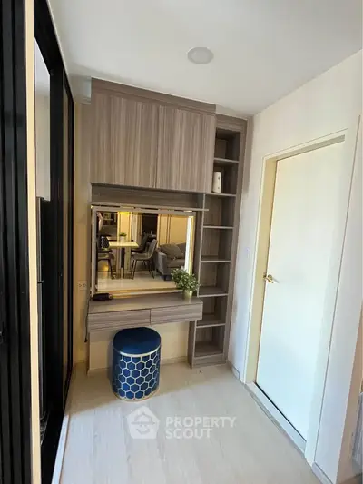 Modern bedroom with stylish vanity and ample storage space