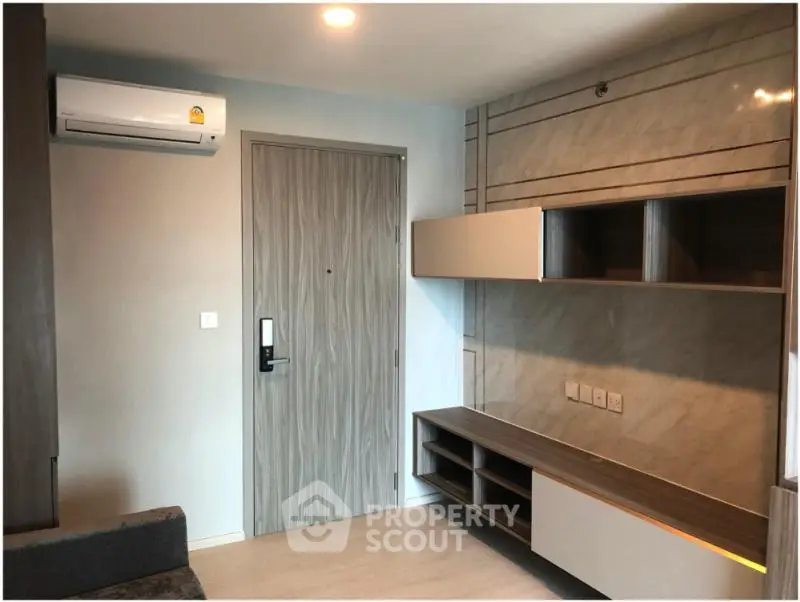 Modern living room with sleek storage and air conditioning