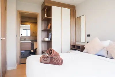 Modern bedroom with ensuite bathroom and stylish wooden furniture