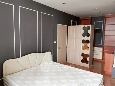 Spacious bedroom with modern design and ample storage space