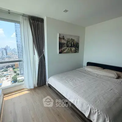 Modern bedroom with city view and elegant decor in high-rise apartment