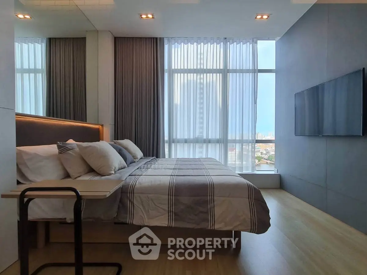 Luxurious modern bedroom with floor-to-ceiling windows and city view