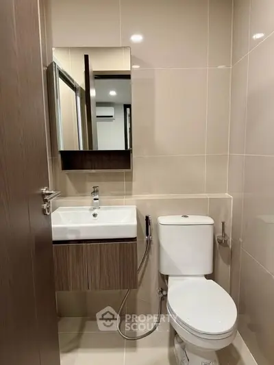 Modern bathroom with sleek fixtures and neutral tones