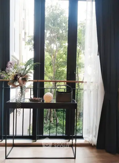 Elegant interior with large windows and lush garden view, perfect for serene living.