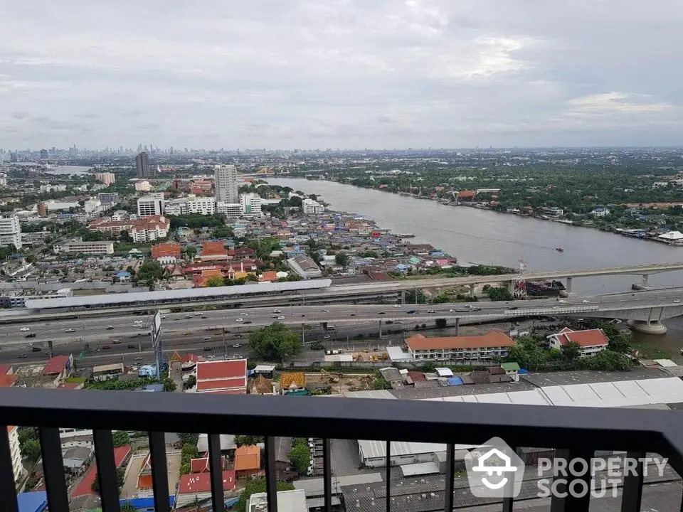 Stunning high-rise balcony view overlooking river and cityscape