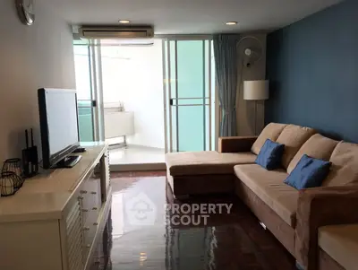 Stylish living room with modern decor and balcony access