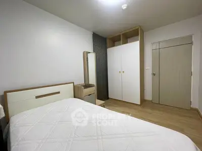 Cozy bedroom with modern furniture and ample storage space