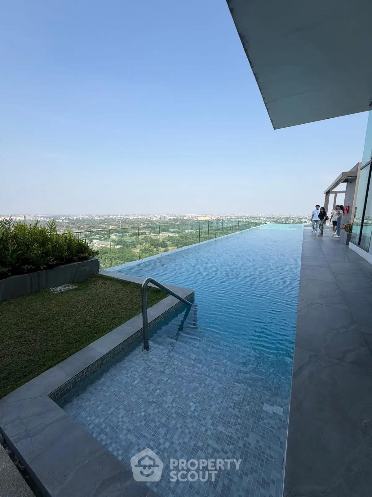 Luxurious rooftop infinity pool with stunning panoramic city views and modern design.