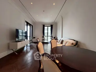 Elegant living room with modern furniture and large windows in a luxury apartment.
