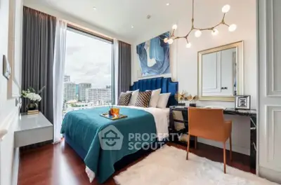 Luxurious bedroom with city view, elegant decor, and modern furnishings in a high-rise apartment.