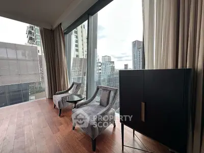 Luxurious high-rise apartment with stunning city view and elegant interior design.