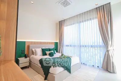 Bright and modern bedroom with large window and stylish decor