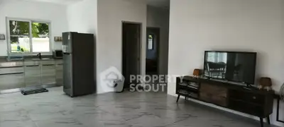 Spacious modern living room with sleek kitchen and stylish decor