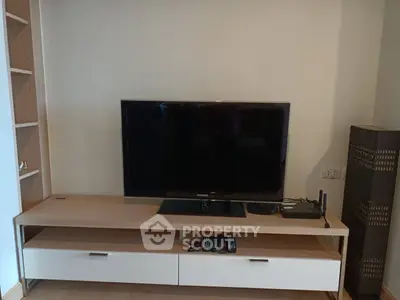Modern living room with sleek TV setup and stylish furniture