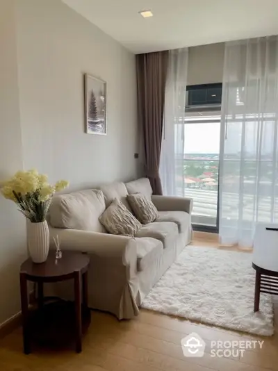 Cozy living room with elegant decor and scenic view from large window.