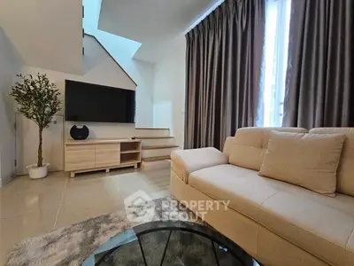 Modern living room with cozy beige sofa and stylish decor