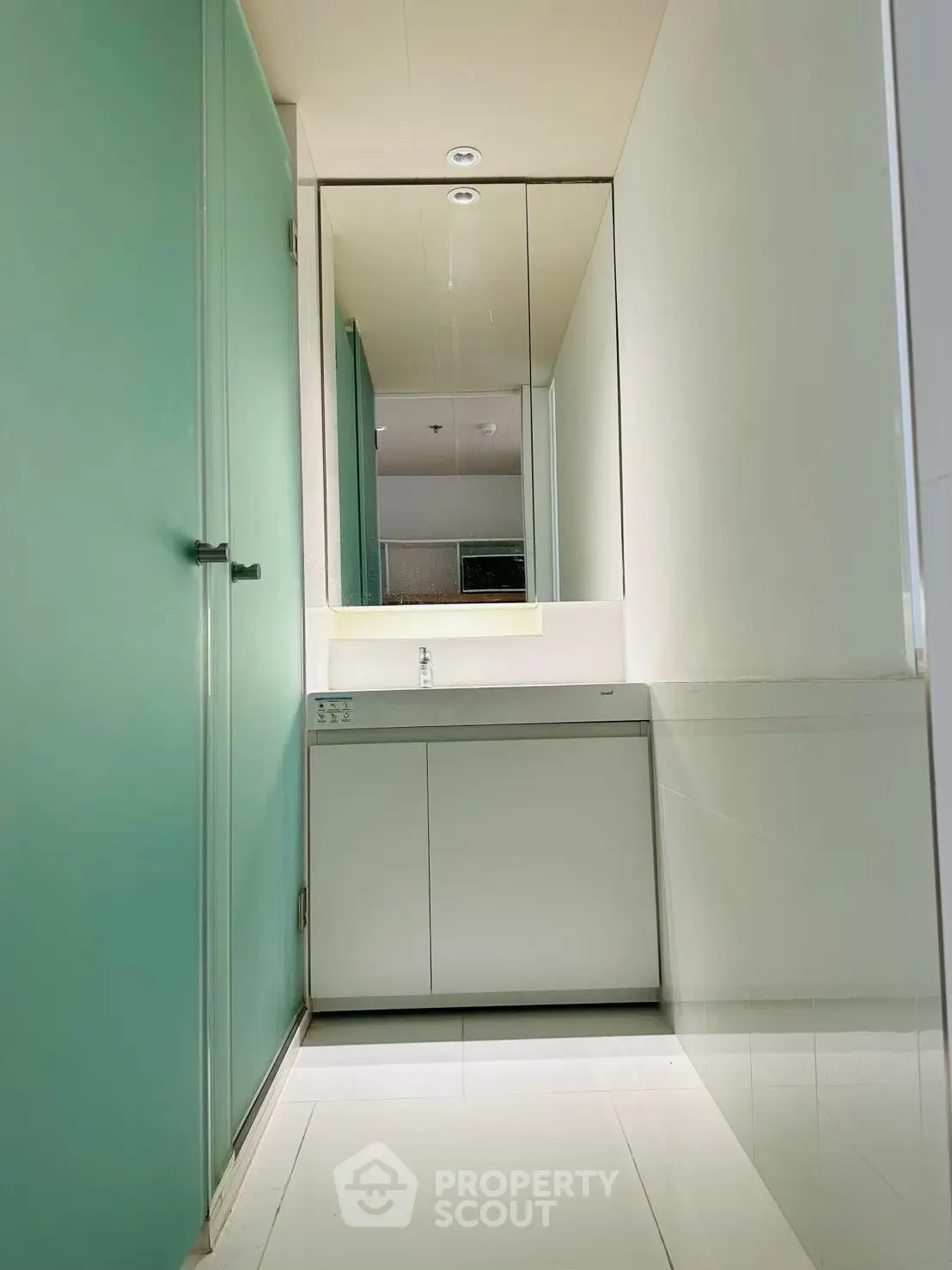 Modern minimalist bathroom with sleek design and large mirror