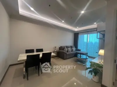 Modern living room with elegant dining area and large windows.