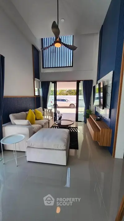 Modern living room with high ceiling and stylish decor