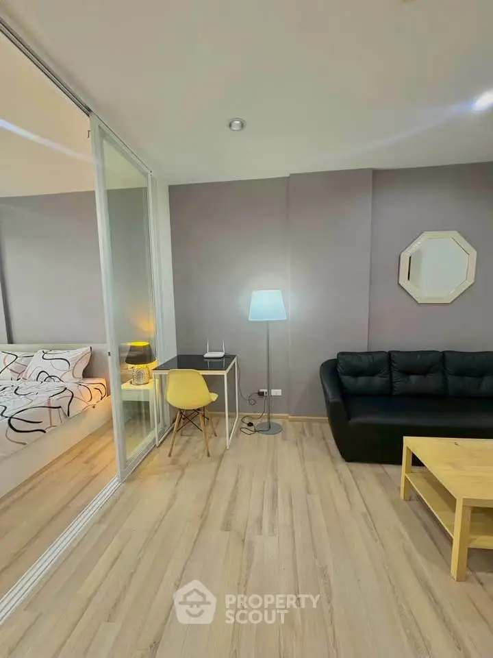Modern living room with sleek design and cozy furniture in a stylish apartment.