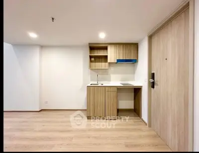 Modern minimalist kitchen with wooden cabinets and sleek design