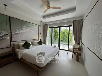 Luxurious bedroom with large windows and nature view, featuring elegant decor and modern furnishings.